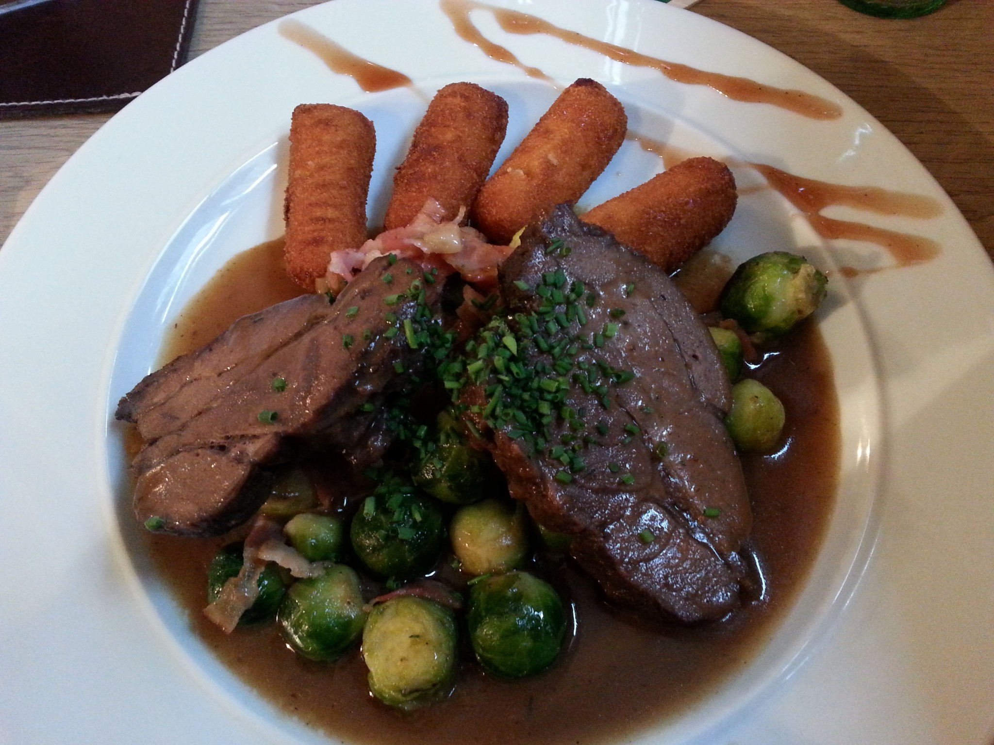 Wildschweinbraten mit Korketten und Speck-Kohlsprossen - Gasthof Alter Fuchs - Salzburg